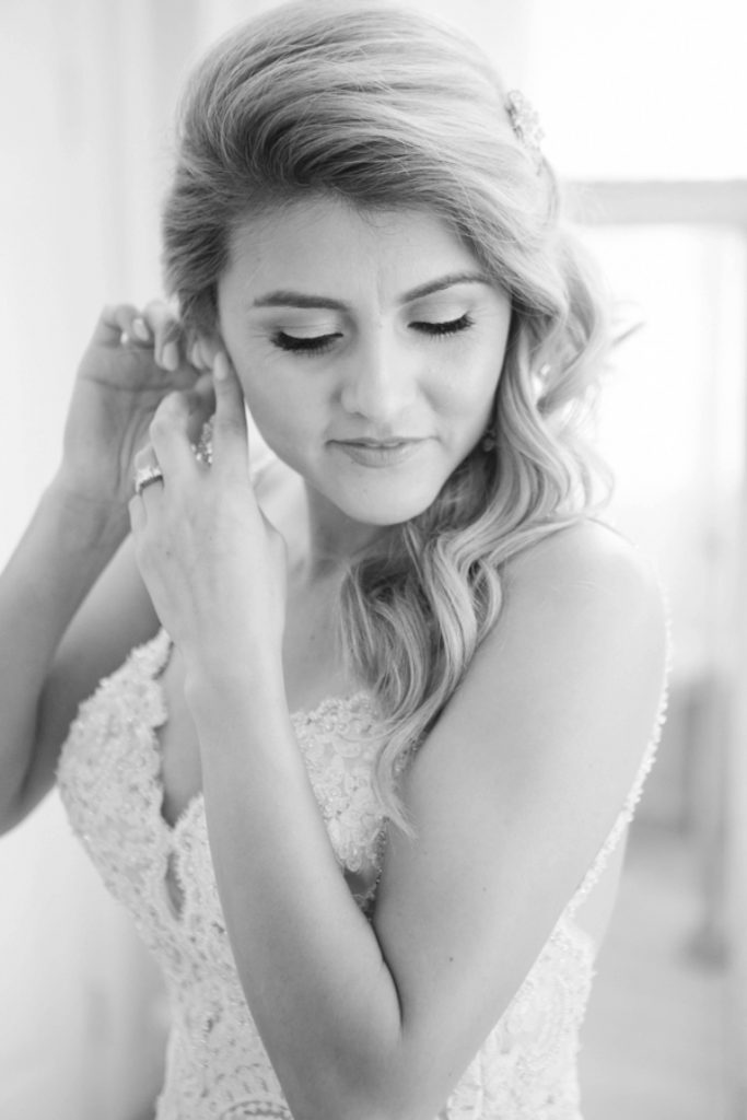 bride getting ready in lace gown Forever and always Farm Johnathan and Bernice Temecula wedding photographer Carrie McGuire Photography
