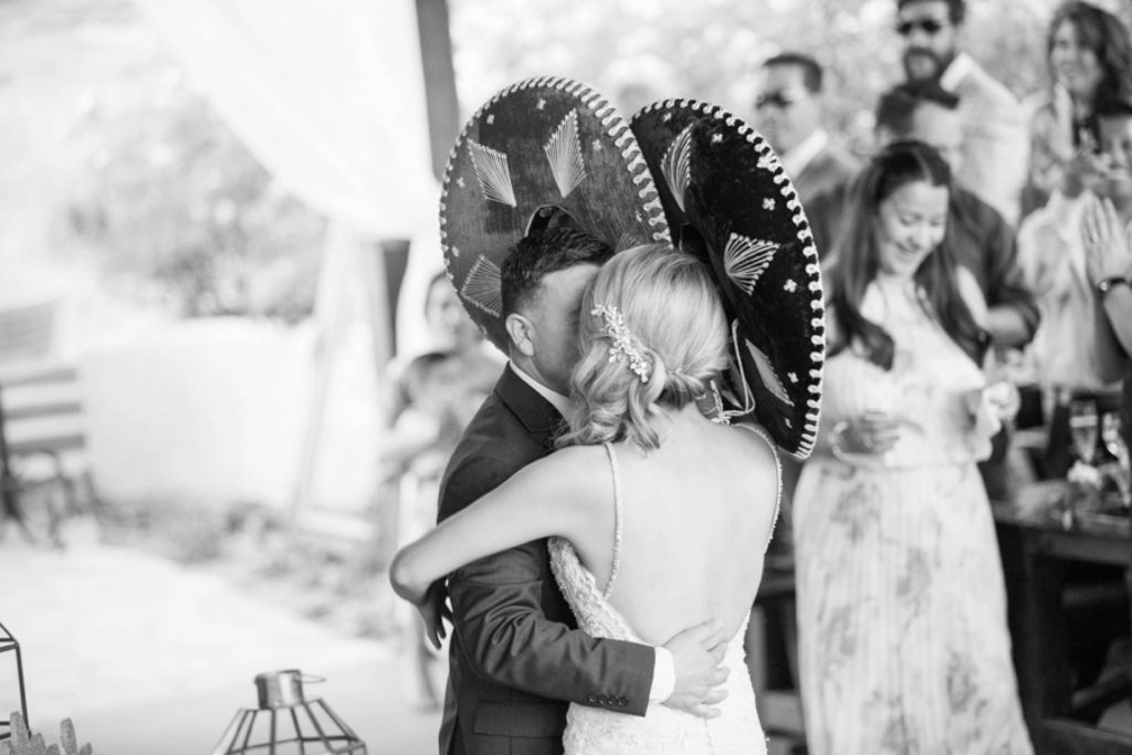 black and white dancing with sombreros Forever and always Farm Johnathan and Bernice Temecula wedding photographer Carrie McGuire Photography