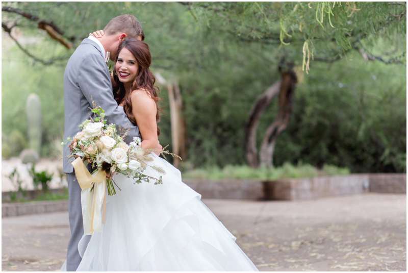 Carrie McGuire photography Temecula photographer bride holding bouquet with groom Tucson Arizona Wedding photographers