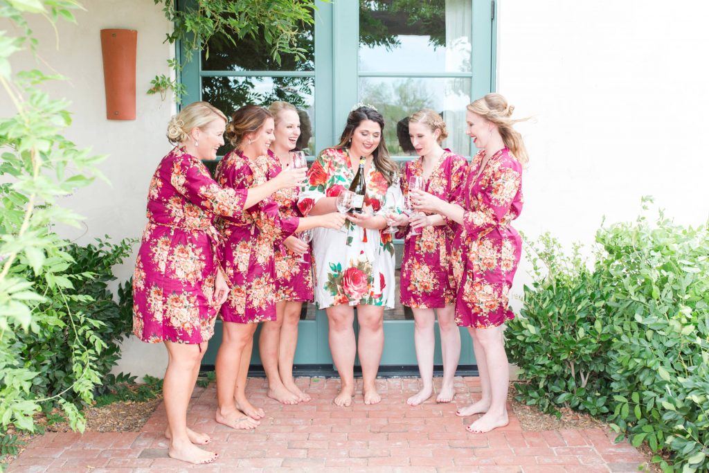 brides and bridesmaids having champagne bridal party Carrie McGuire Photography Temecula Wedding Photography Ponte Inn and Winery 