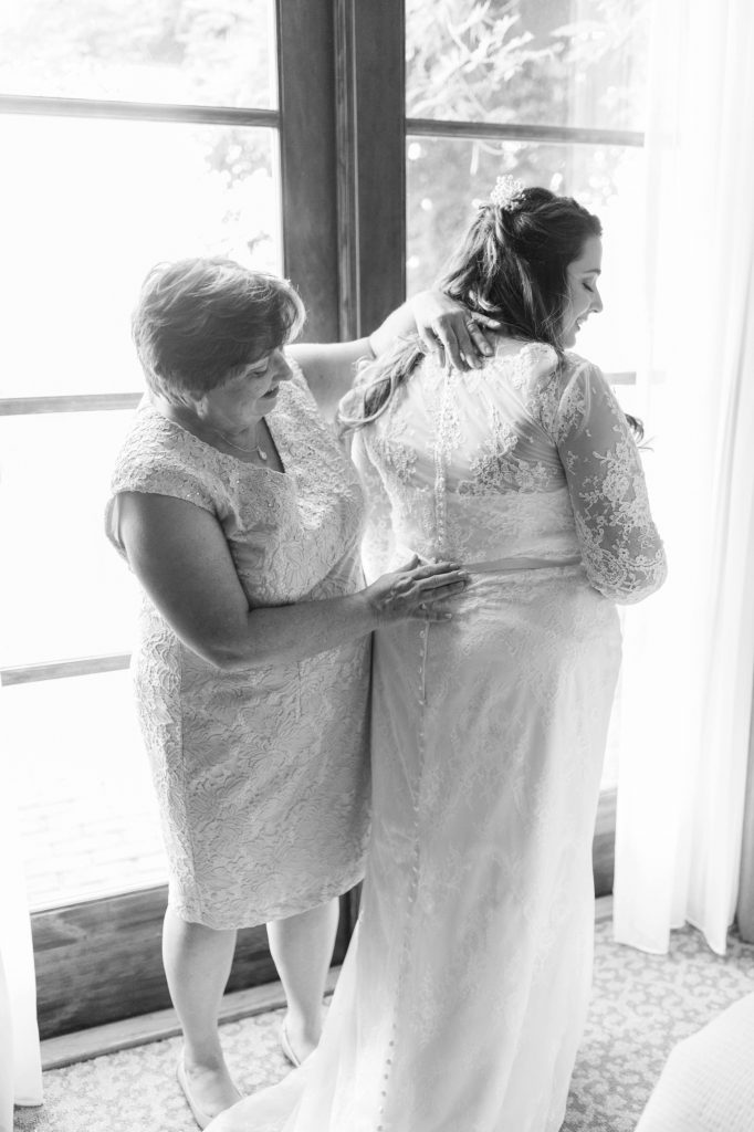 black and white mother of the bride helping Carrie McGuire Photography Temecula Wedding Photography Ponte Inn and Winery 