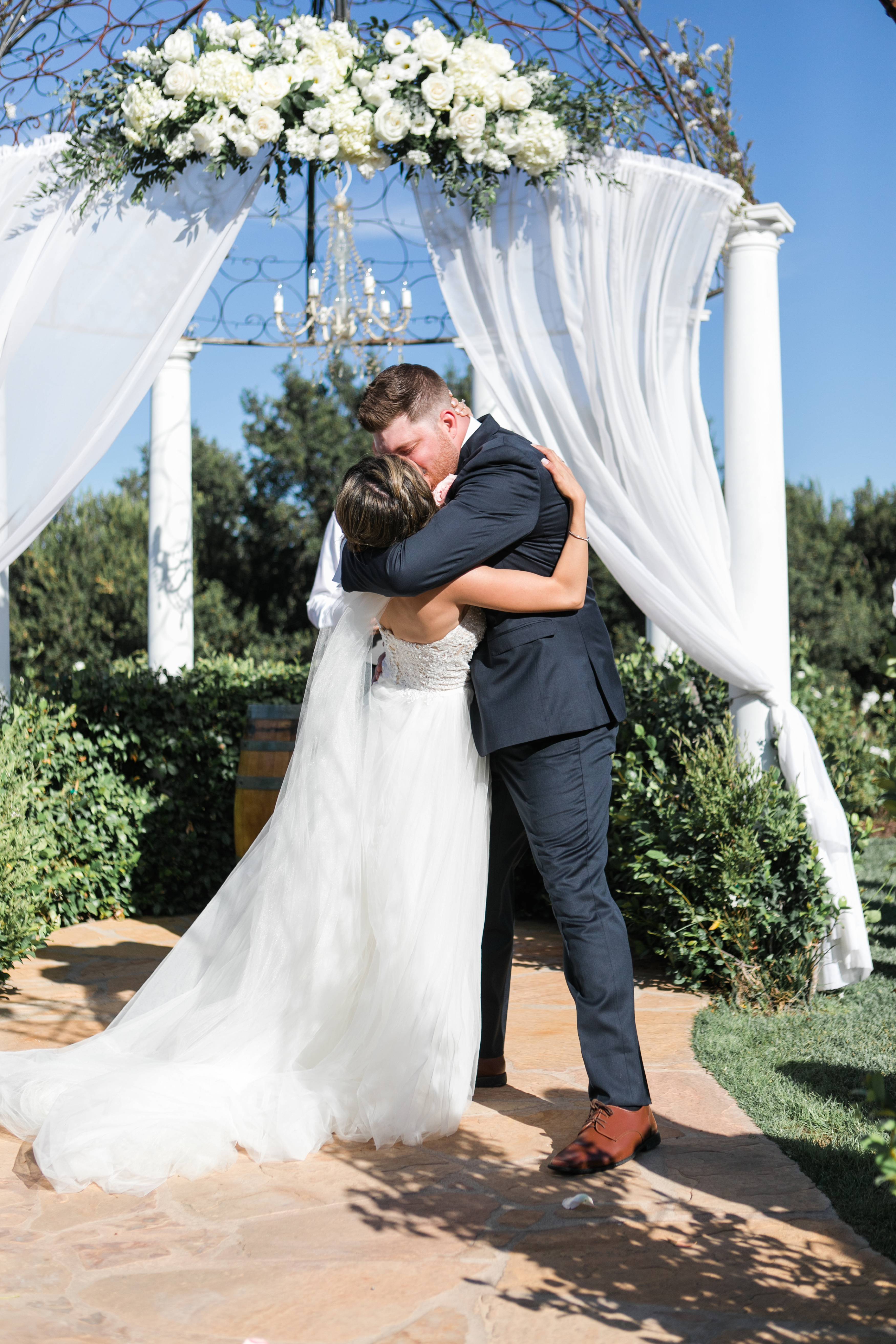 Ceremony wedding kiss at Forever and Always Farm wedding venue in Temecula California