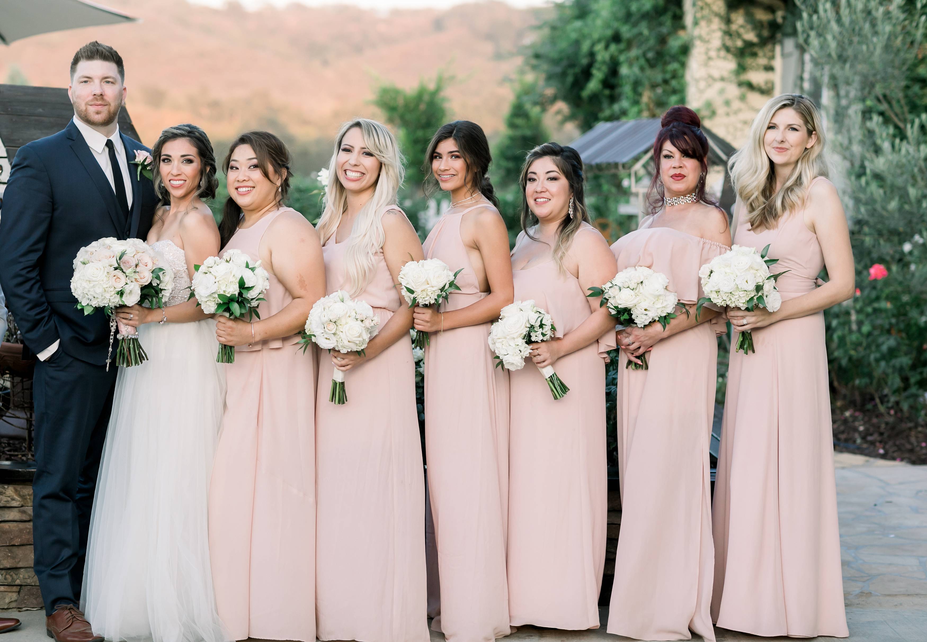 Wedding party in blush dresses and blue suits at Forever and Always Farm in Temecula California 