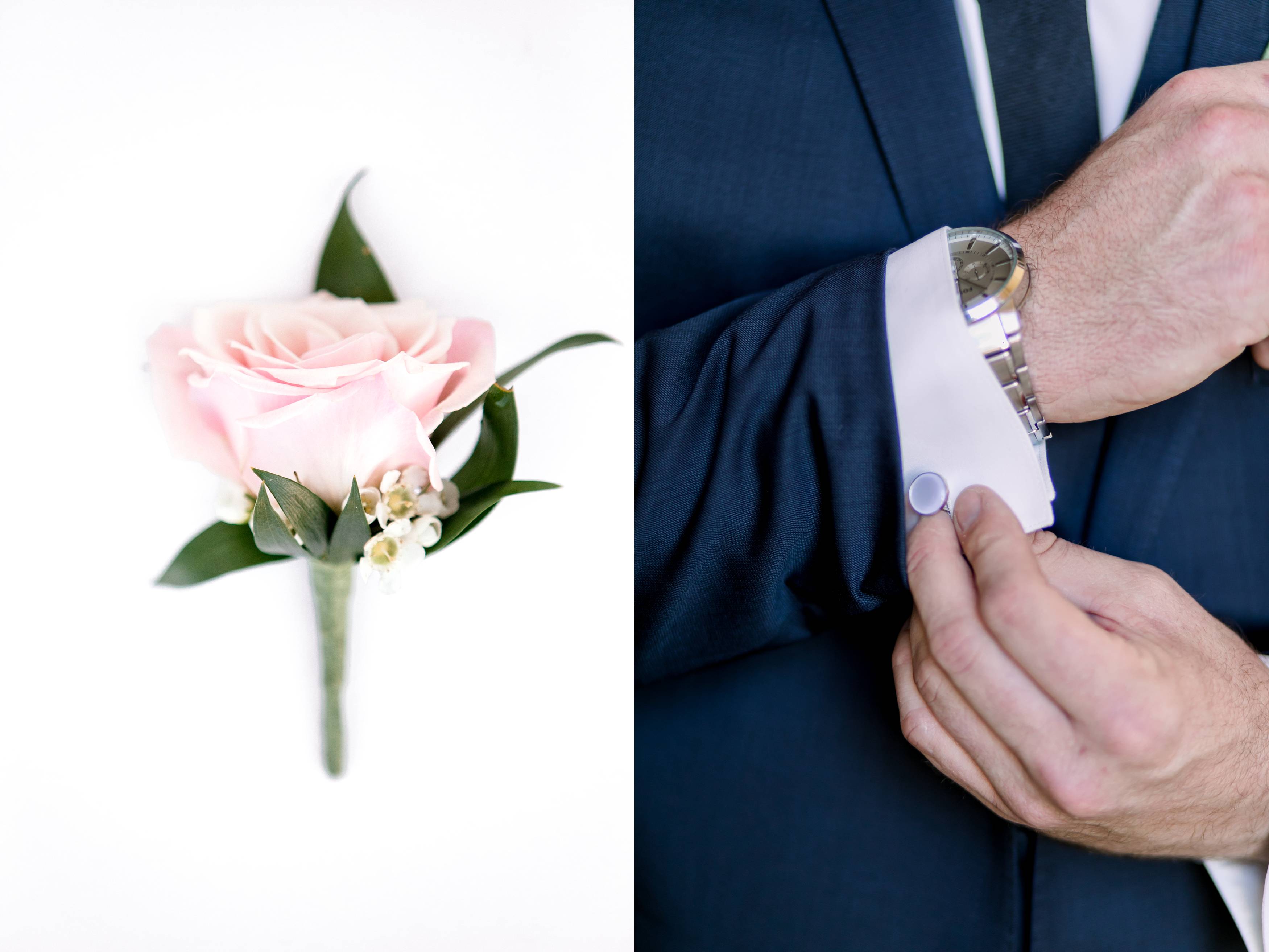 Pink rose boutonniere with blue suit and pearl cufflinks 