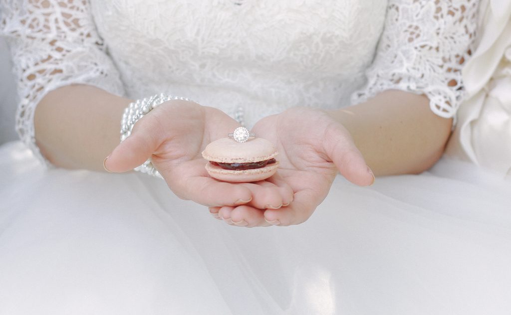 bride holding macaroon and wedding ring Carrie McGuire photography Temecula San Diego wedding photographer Temecula winery photographer wedding Temecula wedding photographer carrie mcguire photography tips for photographers 