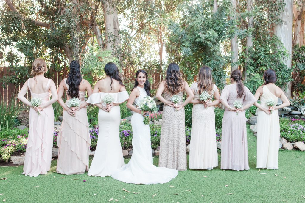 line of bridesmaids with bouquets Twin Oaks House and Garden Estate Wedding Photography San Marcos Wedding Photographer by Carrie Mcguire Photography