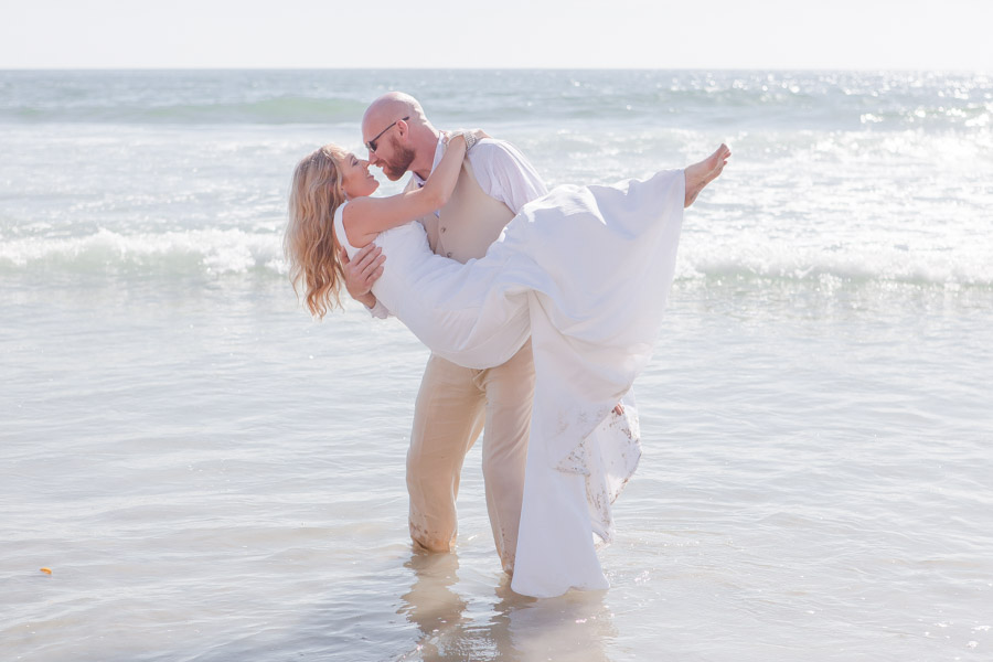 bride and groom on beach kissing Carrie McGuire Photography Temecula wedding photographer beach weddings