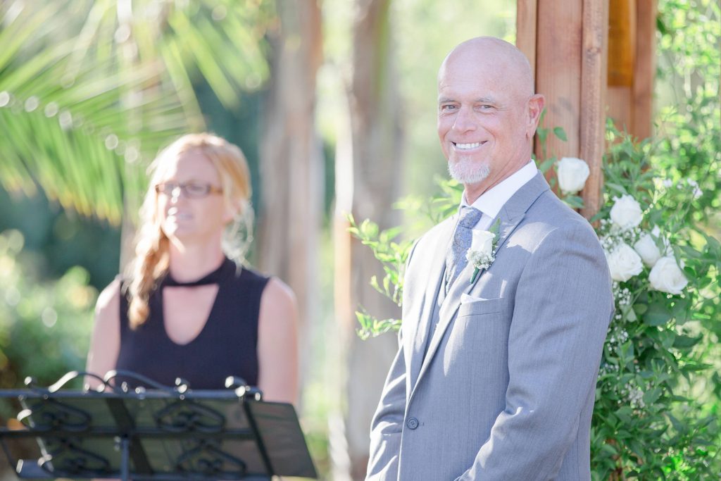 groom at alter before ceremony Meadowview backyard wedding Carrie McGuire Temecula wedding Photography 