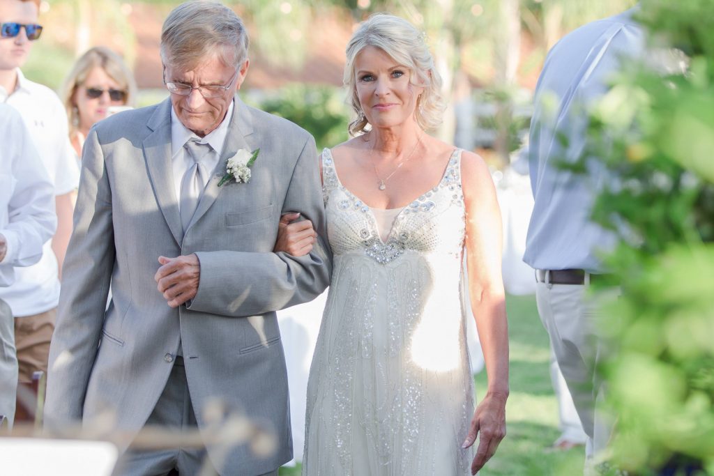 beautiful bride and father of the bride walking down the isle Meadowview backyard wedding Carrie McGuire Temecula wedding Photography 