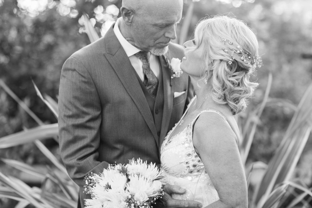 black and white bride and groom in garden Meadowview backyard wedding Carrie McGuire Temecula wedding Photography 