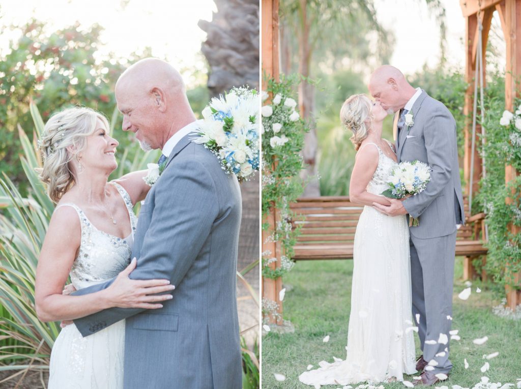 bride and groom hugging and kissing in garden together Meadowview backyard wedding Carrie McGuire Temecula wedding Photography 