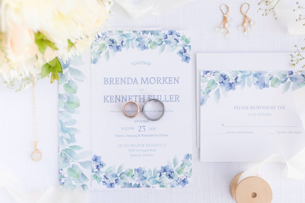 wedding invitations and jewelry with flowers Meadowview backyard wedding Carrie McGuire Temecula wedding Photography 