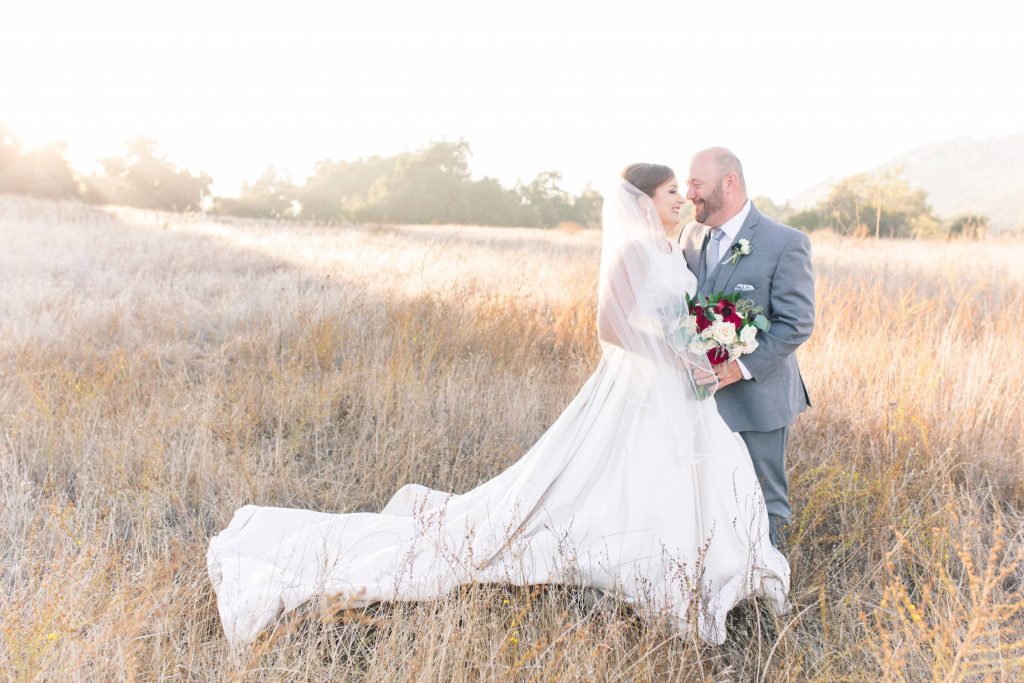 happy newlyweds in beautiful field forever and always farm temecula wedding engagement photography Carrie McGuire photographer california