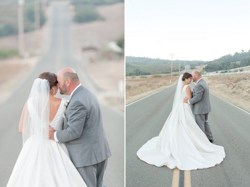 bride and groom holding each other in the road forever and always farm temecula wedding engagement photography Carrie McGuire photographer california