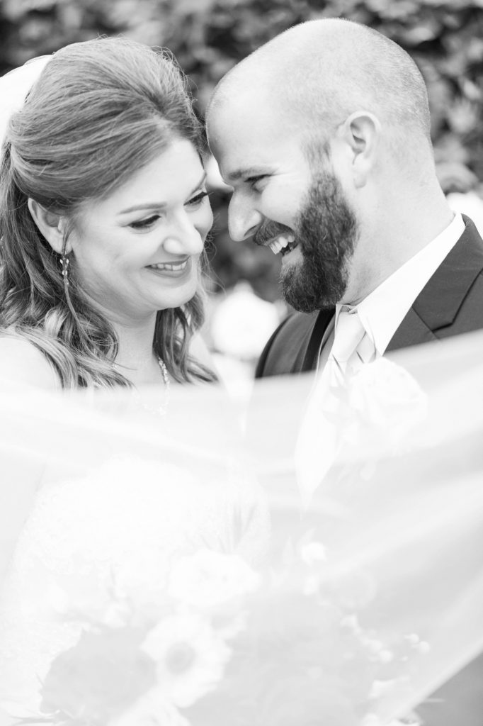 black and white photo of bride and groom laughing Shadow Ridge Golf Club Temecula California wedding engagement maternity photography Carrie McGuire photographer California