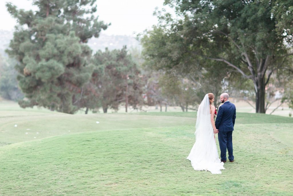 groom and bride holding hands together Shadow Ridge Golf Club Temecula California wedding engagement maternity photography Carrie McGuire photographer California