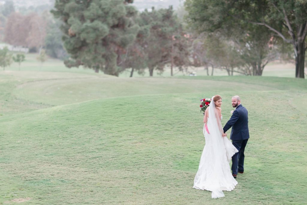 groom and bride looking back together Shadow Ridge Golf Club Temecula California wedding engagement maternity photography Carrie McGuire photographer California