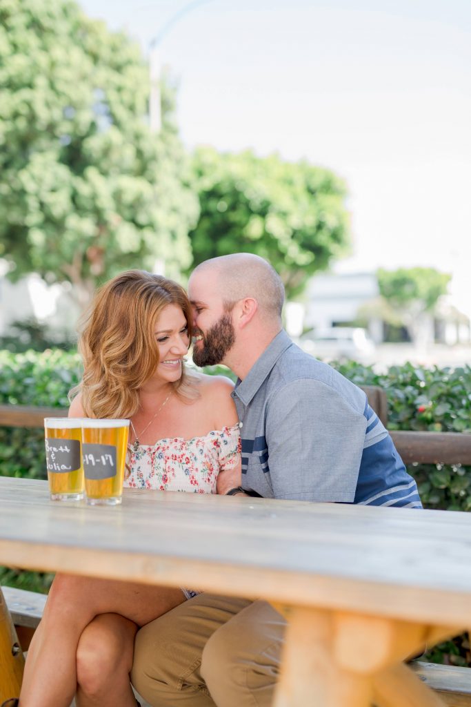happy engaged couple snuggling together belching beaver vista California Carrie McGuire Temecula wedding engagement Photography 
