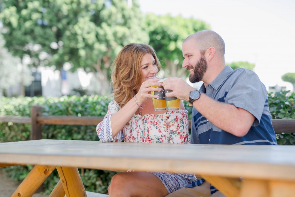 cheers happy engaged couple belching beaver vista California Carrie McGuire Temecula wedding engagement Photography 