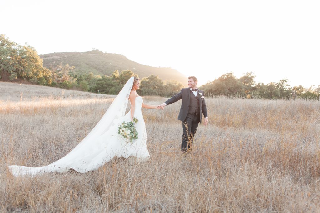 bride and groom in field at sunset forever and always farm temecula wedding engagement photography Carrie McGuire photographer california