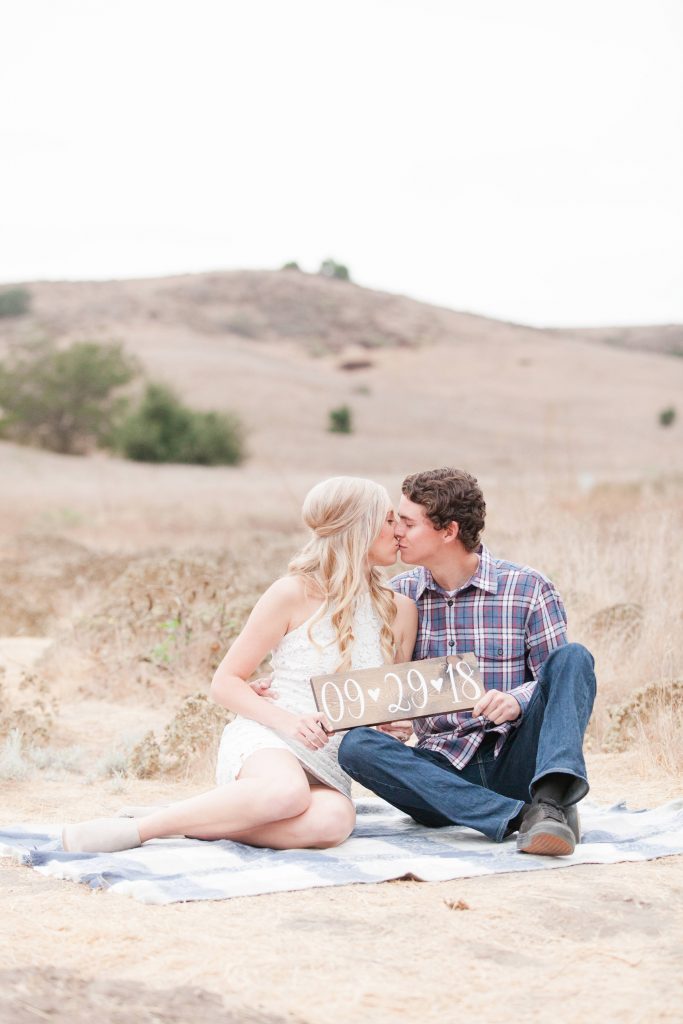 kissing couple save the date Thomas f Riley wilderness park Orange County California wedding engagement maternity photography Carrie McGuire photographer California