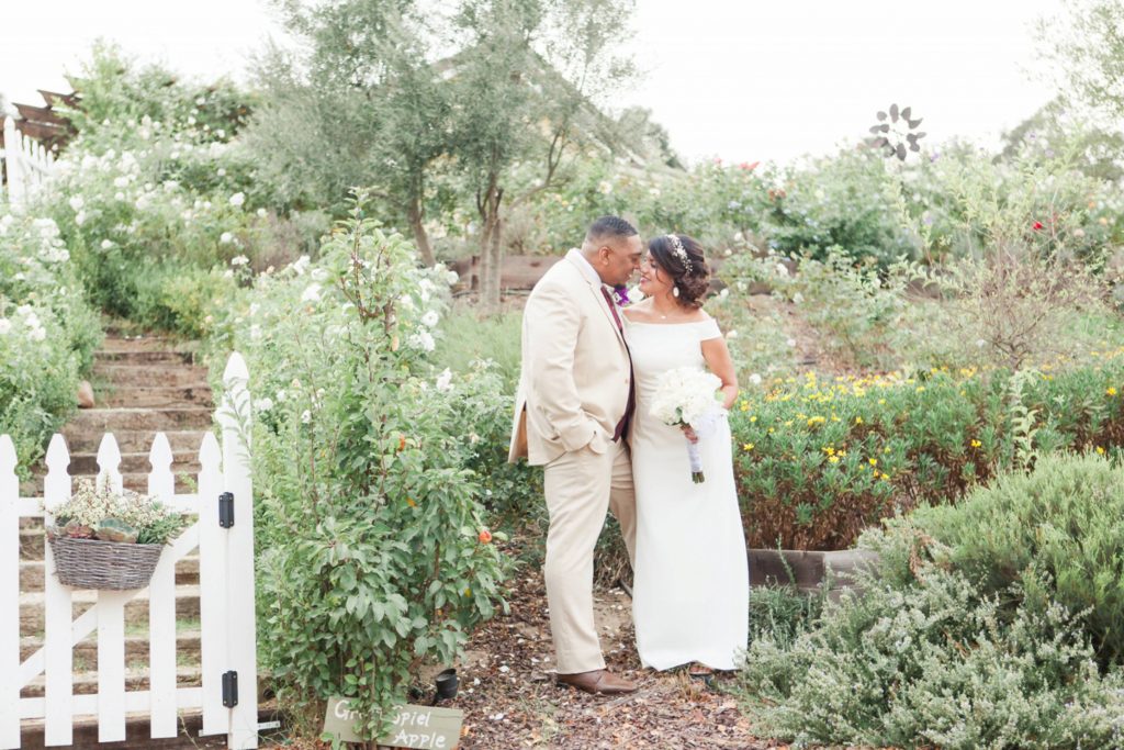 bride and groom first look kissing in garden Forever and always farm Temecula California wedding engagement family maternity photography Carrie McGuire photographer