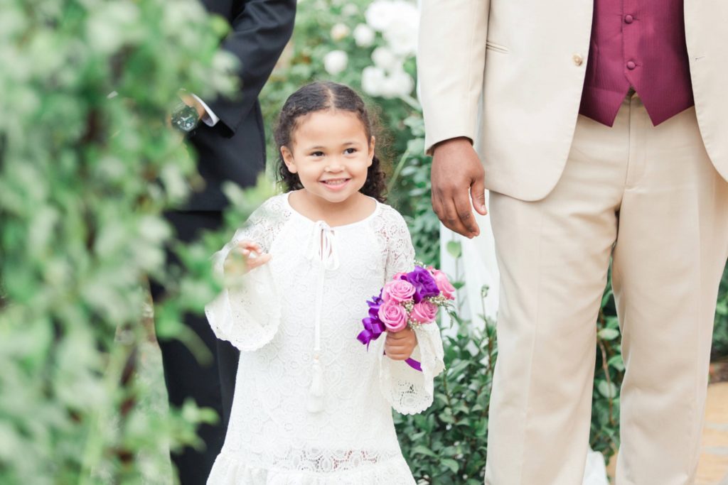 flower girl walking down the isle at ceremony Forever and always farm Temecula California wedding engagement family maternity photography Carrie McGuire photographer