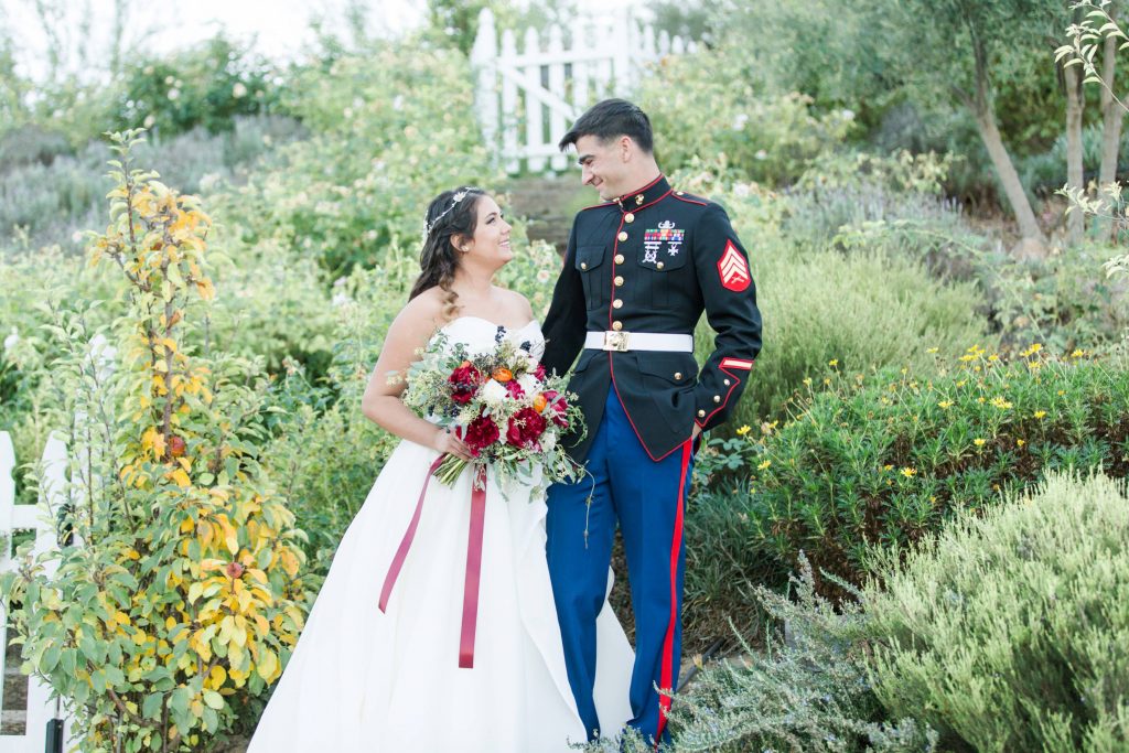 beautiful bride and handsome groom in garden Forever and always farm Temecula California wedding engagement family maternity photography Carrie McGuire photographer