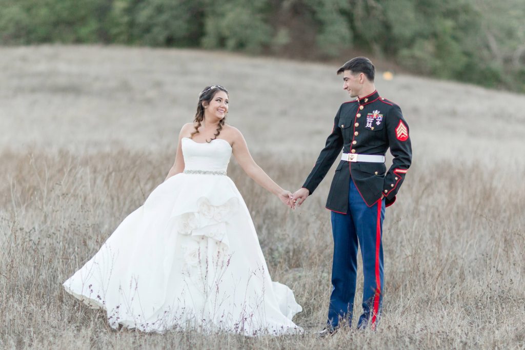 beautiful bride and groom holding hands in a field Forever and always farm Temecula California wedding engagement family maternity photography Carrie McGuire photographer