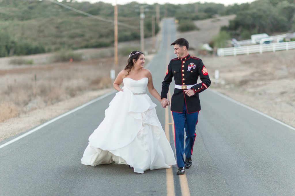Marine wedding couple walking down the road at forever and always farm