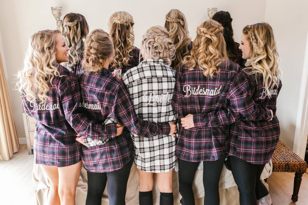 bride and bridesmaids having champagne in matching shirts Temecula Coachhouse California wedding engagement photography Carrie McGuire photographer California