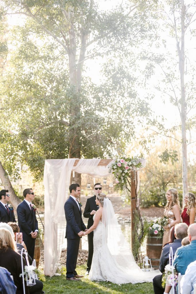 bride and groom exchange vows Temecula Coachhouse California wedding engagement photography Carrie McGuire photographer California