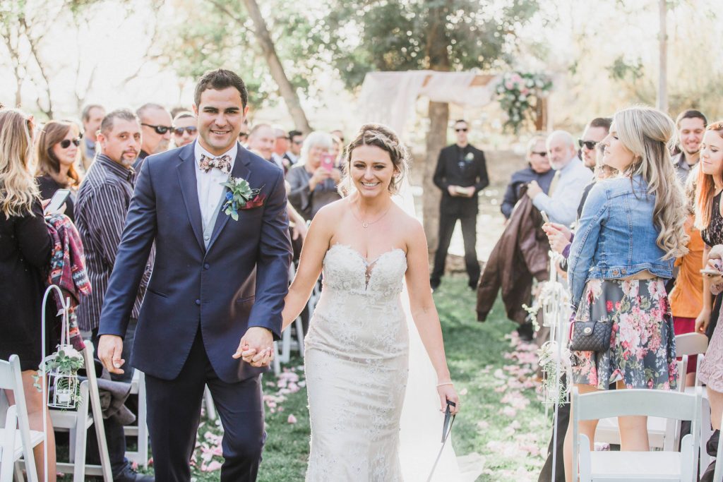 bride and groom walking down isle after ceremony Temecula Coachhouse California wedding engagement photography Carrie McGuire photographer California