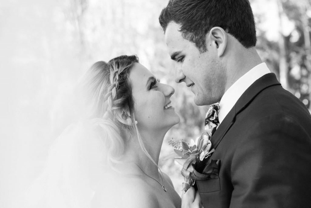 bride and groom posing together on a dock with veil Temecula Coachhouse California wedding engagement photography Carrie McGuire photographer California