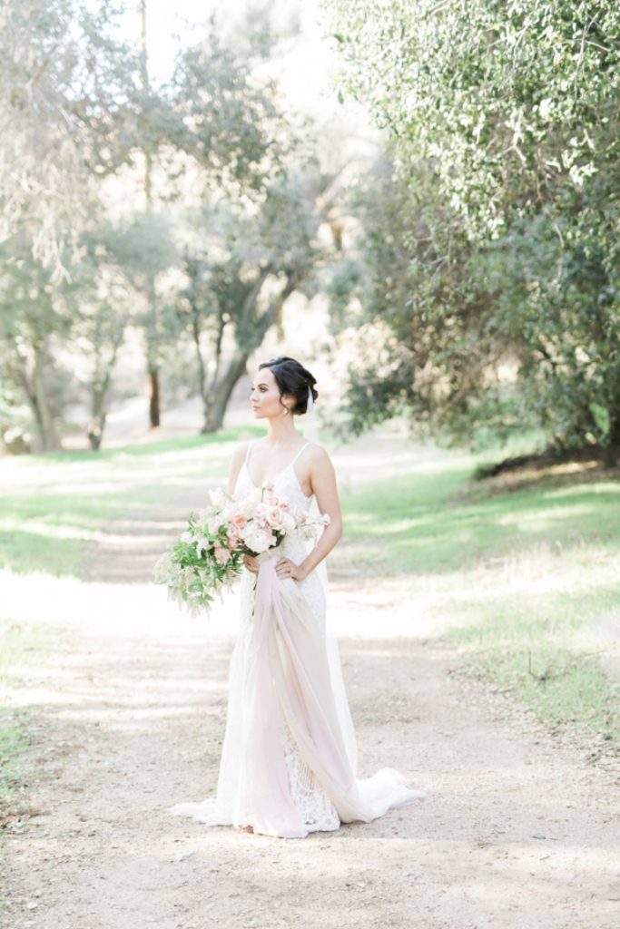 bride walking down path with bouquet Temecula California wedding venues Orange County wedding engagement photography Carrie McGuire photographer California