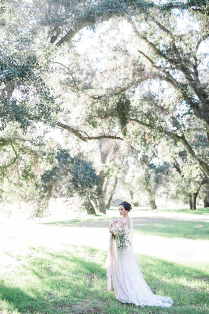 gorgeous scenery and bride holding bouquet Temecula California wedding venues Orange County wedding engagement photography Carrie McGuire photographer California