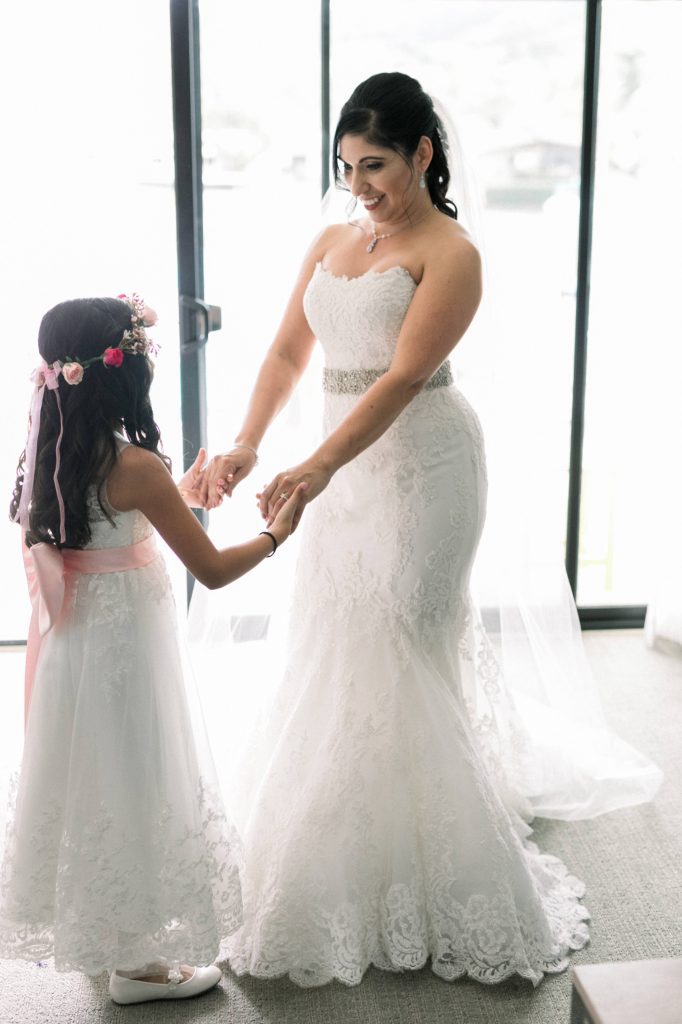 bride and flower girl dancing while getting ready Lakehouse Resort San Marcos Rachel and Steven Temecula California wedding engagement photography Carrie McGuire photographer California