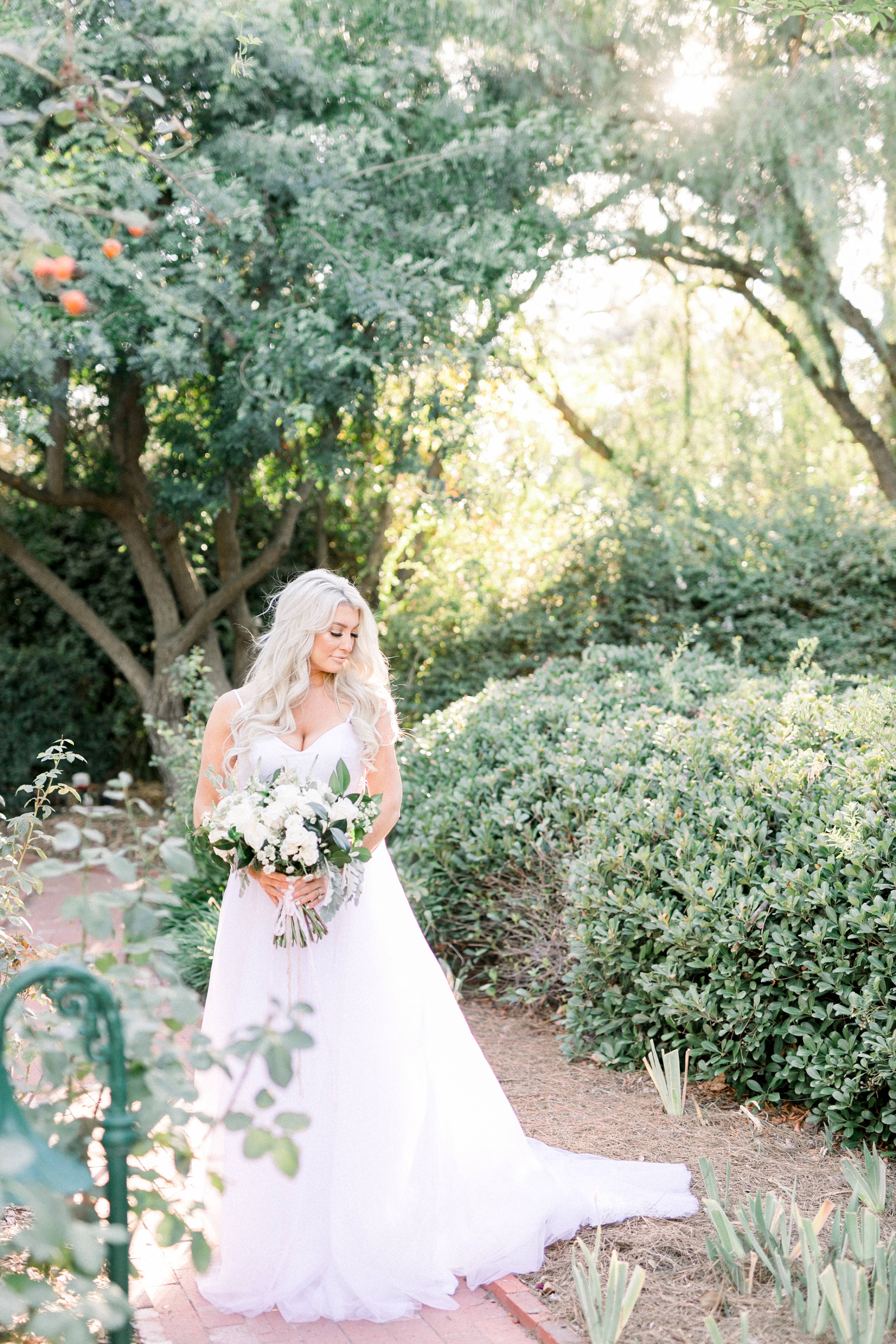 Beautiful blonde bride in the garden at temecula wedding venue captured by temecula wedding photographer carrie mcguire photography