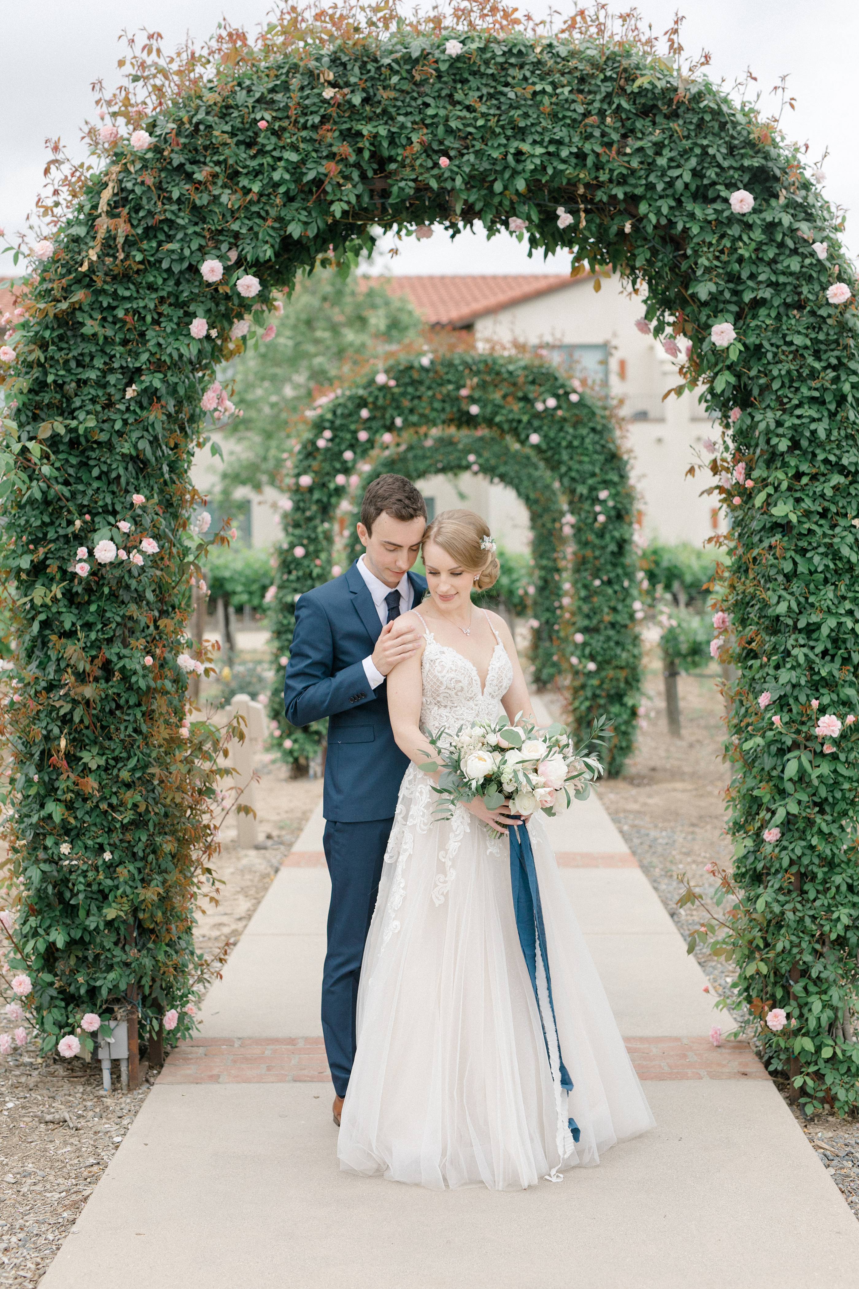 Bride and groom together for garden style winery wedding at Ponte Winery in Temecula California captured by Carrie Mcguire Photography